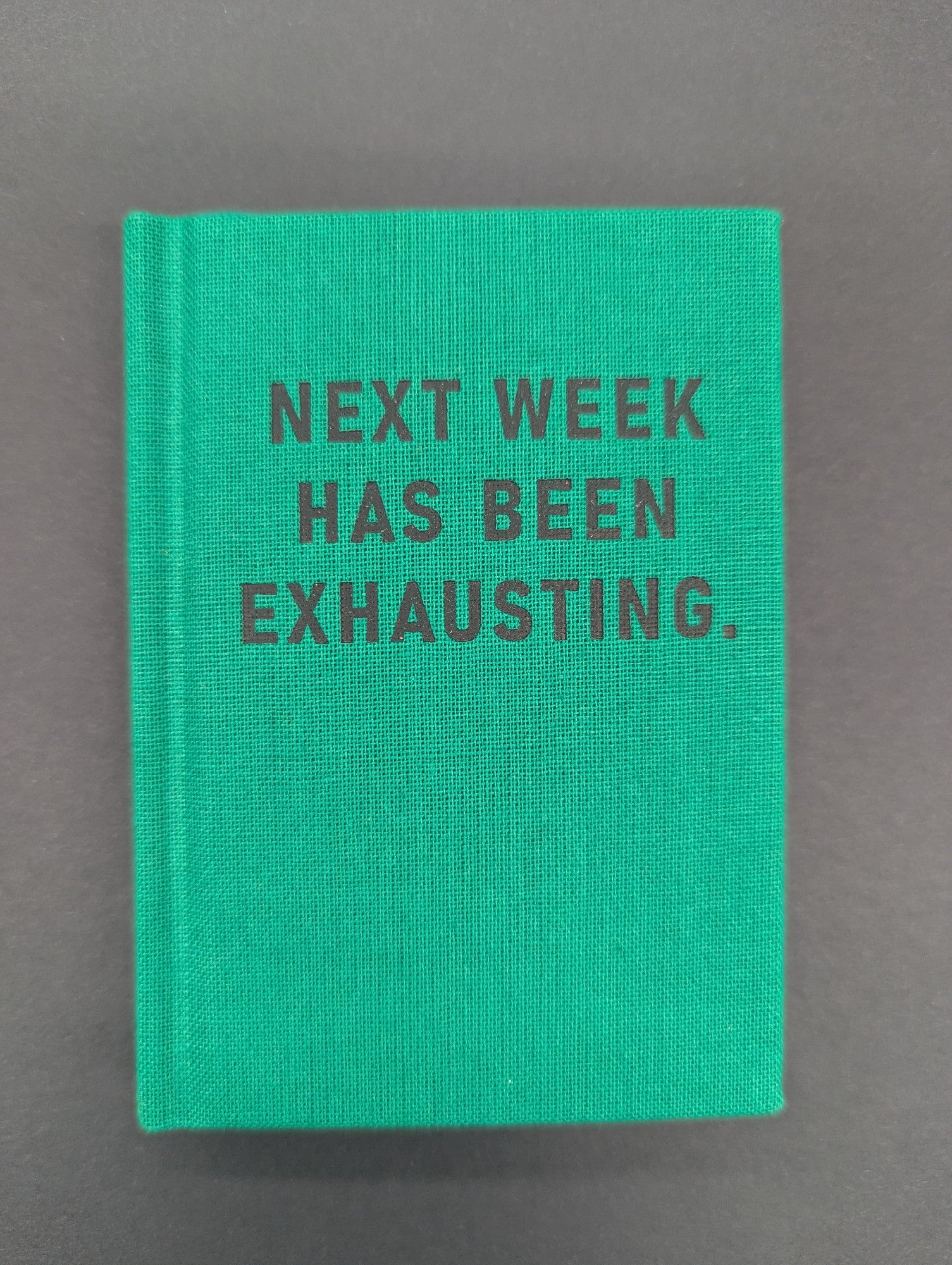 HARD COVER TINY NOTEBOOK NEXT WEEK HAS BEEN EXHAUSTING