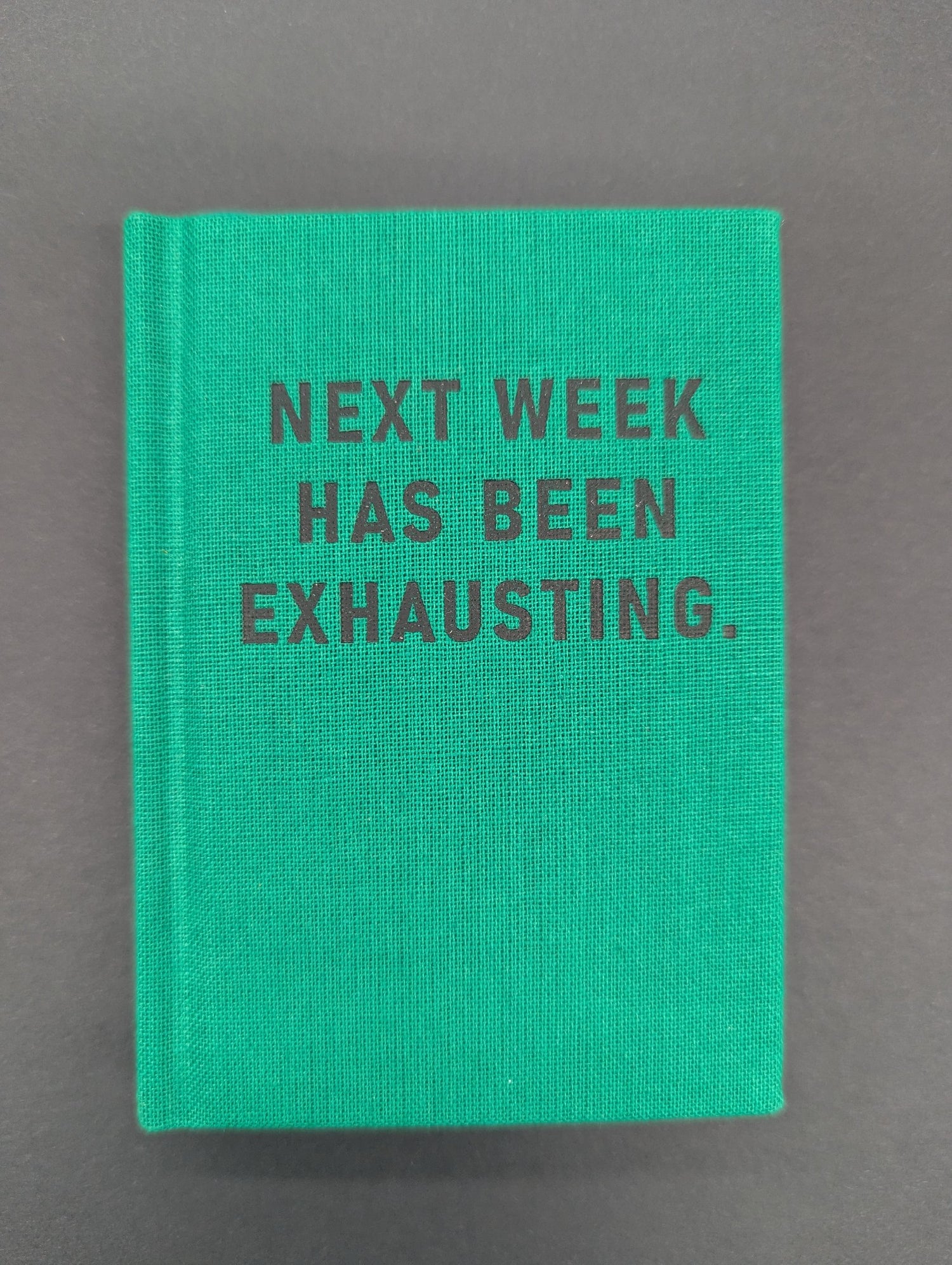 HARD COVER TINY NOTEBOOK NEXT WEEK HAS BEEN EXHAUSTING